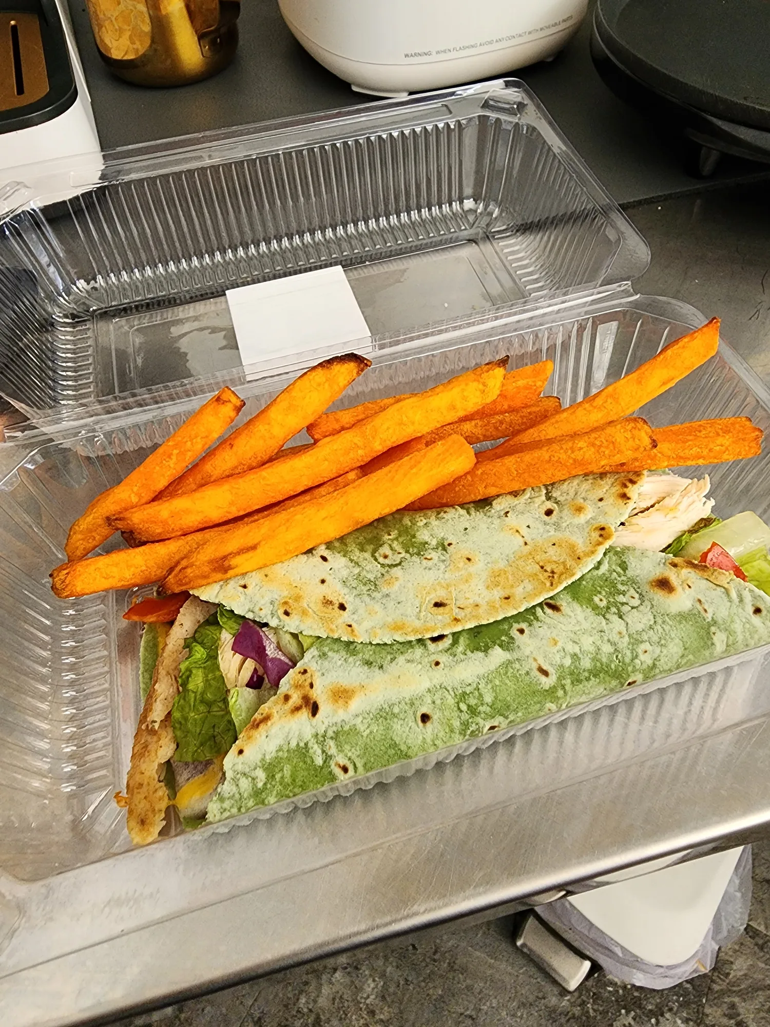Grilled chicken wrap with sweet potato fries from Fit Fuel Cafe